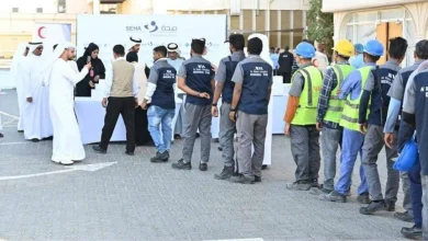 توزيع ملابس شتوية على 300 عامل بالعين